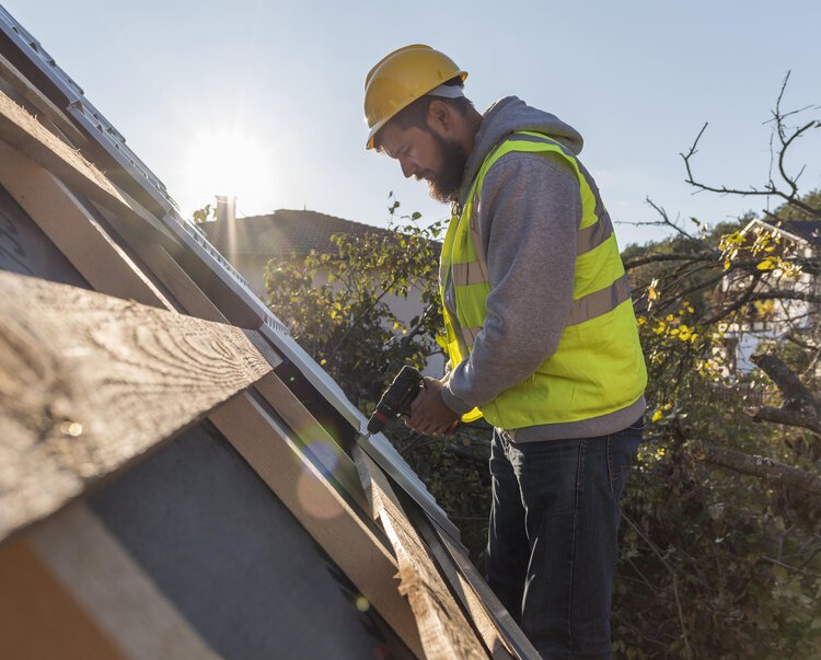 man-working-roof-with-drilljpeg.jpg